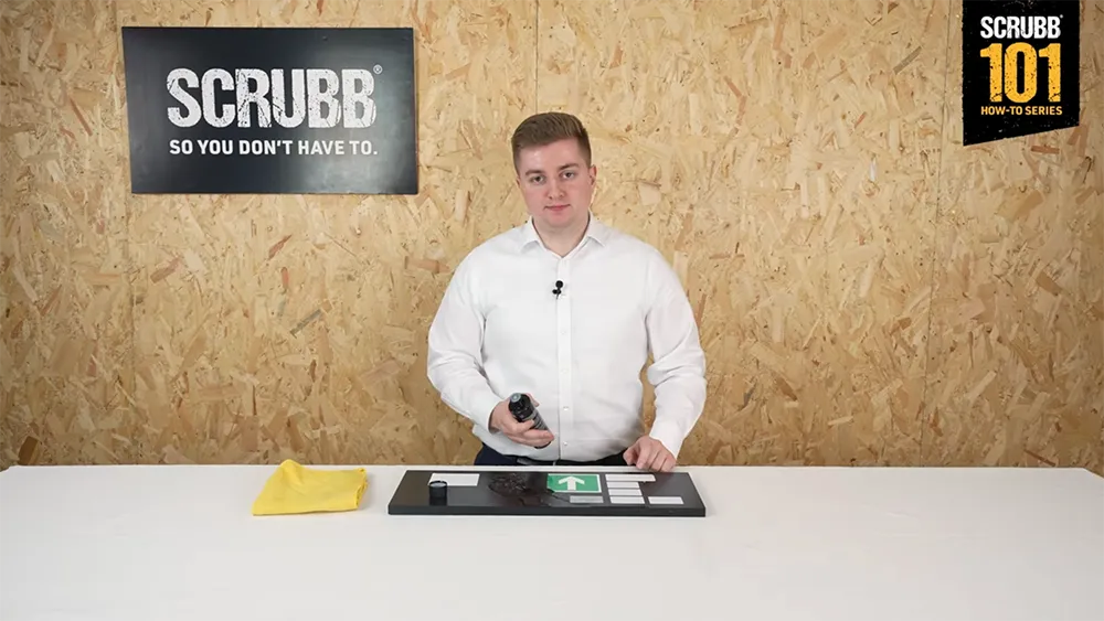 Video screenshot of host demonstrating SCRUBB G44 Adhesive Remover