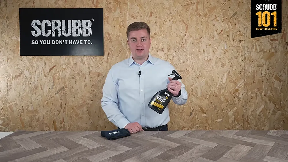 Video screenshot of host demonstrating G83 HARDWOOD & LAMINATE FLOOR CLEANER