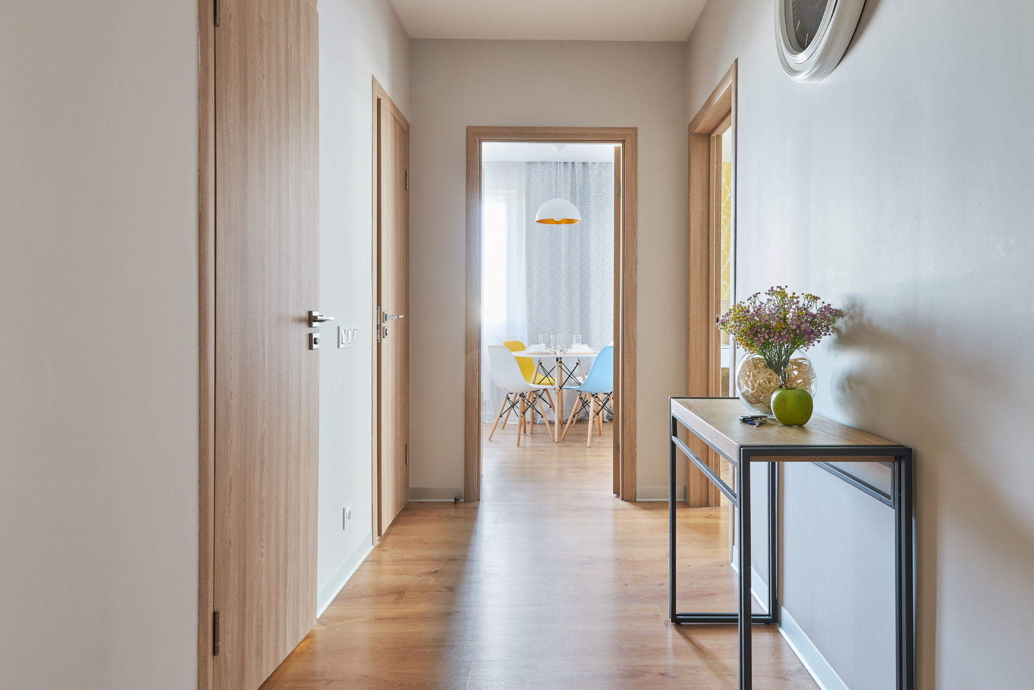 Clean bright neutral coloured hallway with soft sunlight